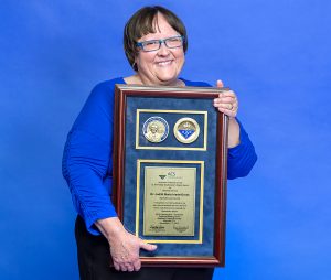 MTSU chemistry professor Judith Iriarte-Gross poses with the American Chemical Society's E. Ann Nalley Southeastern Regional Award for Volunteer Service that she received this past spring. The society has now included Iriarte-Gross in its 2016 class of American Chemical Society Fellows for her outstanding achievements in and contributions to science and her profession. (MTSU file photo by Andy Heidt)