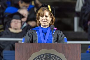 MTSU advertising and public relations professor Tricia Farwell, outgoing president of the university’s Faculty Senate, encourages 886 new graduates to “create the most outrageous adventures that you can” during MTSU’s summer 2016 commencement ceremony Saturday, Aug. 6, in Murphy Center. (MTSU photo by J. Intintoli)