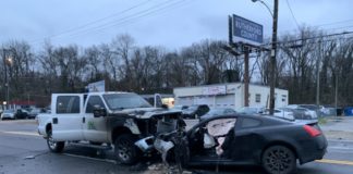 The driver of a truck that was hit head-on jumps out and pulls two men and woman from a wrecked car moments before it burst into flames Thursday morning.