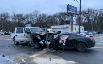 The driver of a truck that was hit head-on jumps out and pulls two men and woman from a wrecked car moments before it burst into flames Thursday morning.