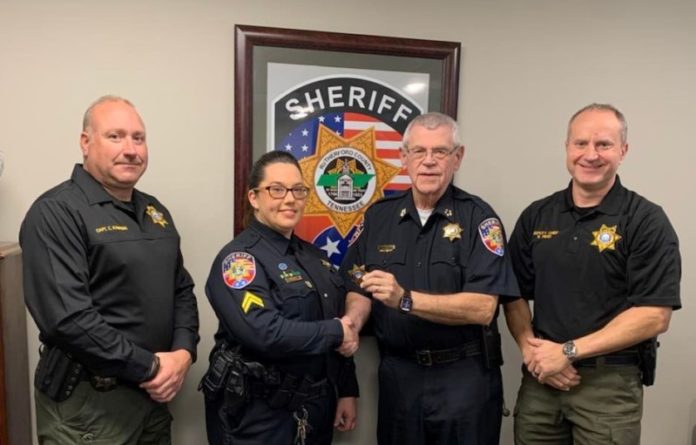 Photo: Sheriff Mike Fitzhugh promotes Cpl. April Haggard to patrol sergeant. Flanking them are Patrol Capt. Chris Kauffman, left, and Deputy Chief Britt Reed