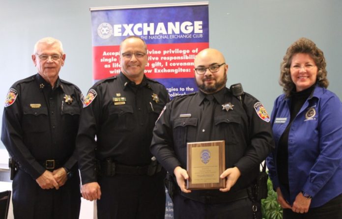 Cutline: President Melissa Wright presents the Murfreesboro Exchange Club Sheriff's Officer of the Year Award to Deputy Nathan Smith. At left is Sheriff Mike Fitzhugh and Lt. Derek Oeser.