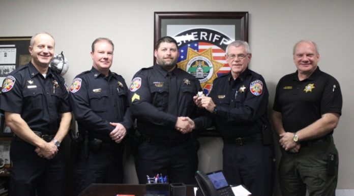 Photo: Sheriff Mike Fitzhugh promotes Sgt. Bryant Gregory to lieutenant. At left is Deputy Chief Britt Reed and Judicial Services Capt. Joey King and at right is Chief Deputy Keith Lowery.
