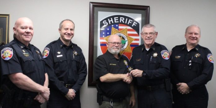 Sheriff Mike Fitzhugh promoted Cpl. Rick Emslie to sergeant this week. At left are Deputy Chief Steve Spence and Deputy Chief Britt Reed and at right is Chief Deputy Keith Lowery